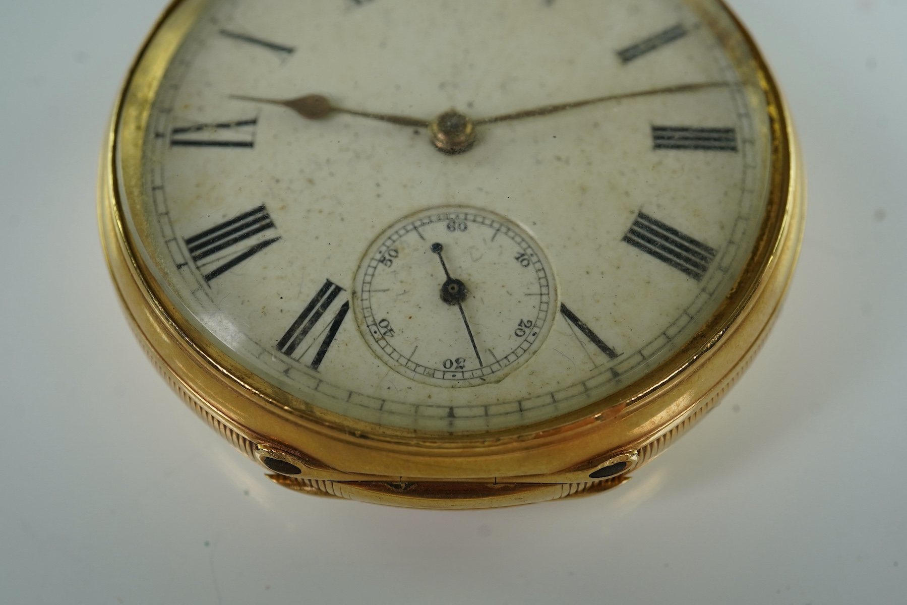 A late Victorian engine turned 18ct gold open faced keyless pocket watch by The American Waltham Watch Company